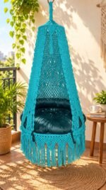 40 inch sea green macrame swing with green cushion on a sunny balcony
