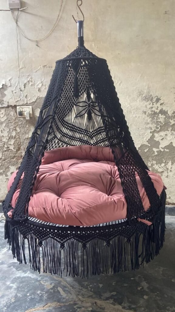 Actual photo of the 60 inch black macrame swing with pink cushion