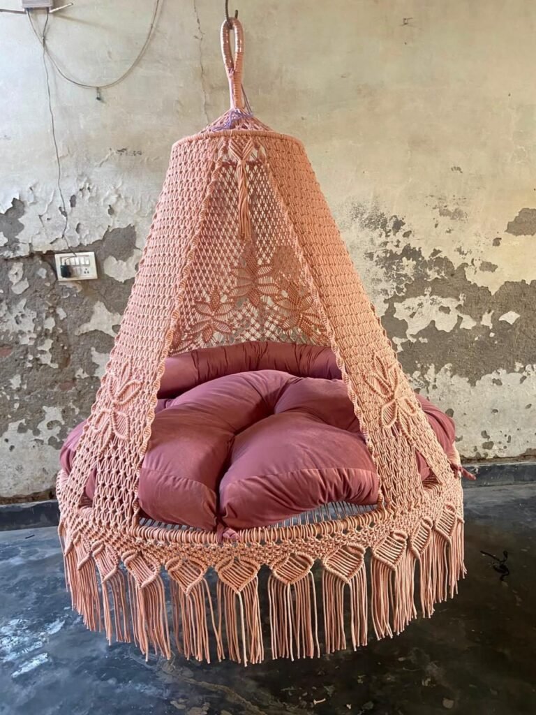 Actual photo of the 60 inch natural light pink macrame swing with pink cushion