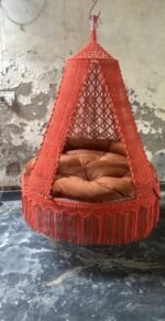 Actual photo of the 60 inch orange macrame swing with orange cushion