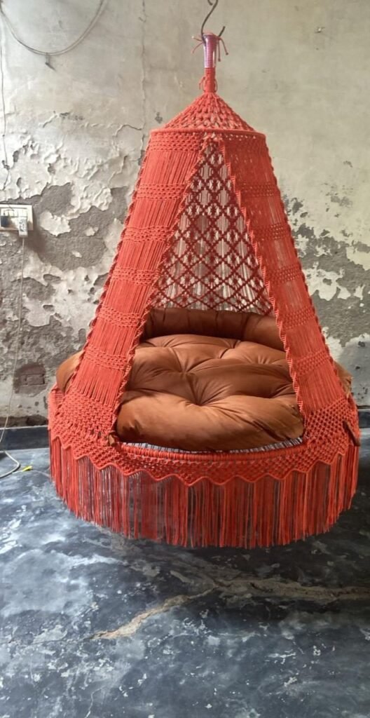 Actual photo of the 60 inch orange macrame swing with orange cushion
