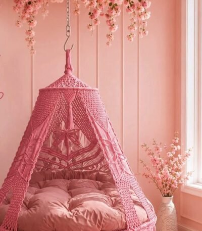 70 inch baby pink macrame swing with pink cushion in a pink room