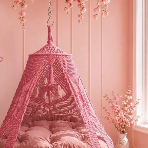 70 inch baby pink macrame swing with pink cushion in a pink room