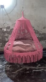 Actual photo of the 70 inch baby pink macrame swing with pink cushion