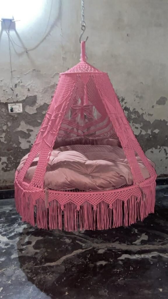 Actual photo of the 70 inch baby pink macrame swing with pink cushion