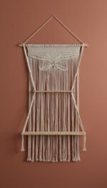 ProKnots macrame wall hanging shelf with butterfly design and two wooden shelves on a terracotta wall